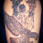 Dog and red-tailed hawk tattoo