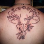 Deer skull and moon phases tattoo